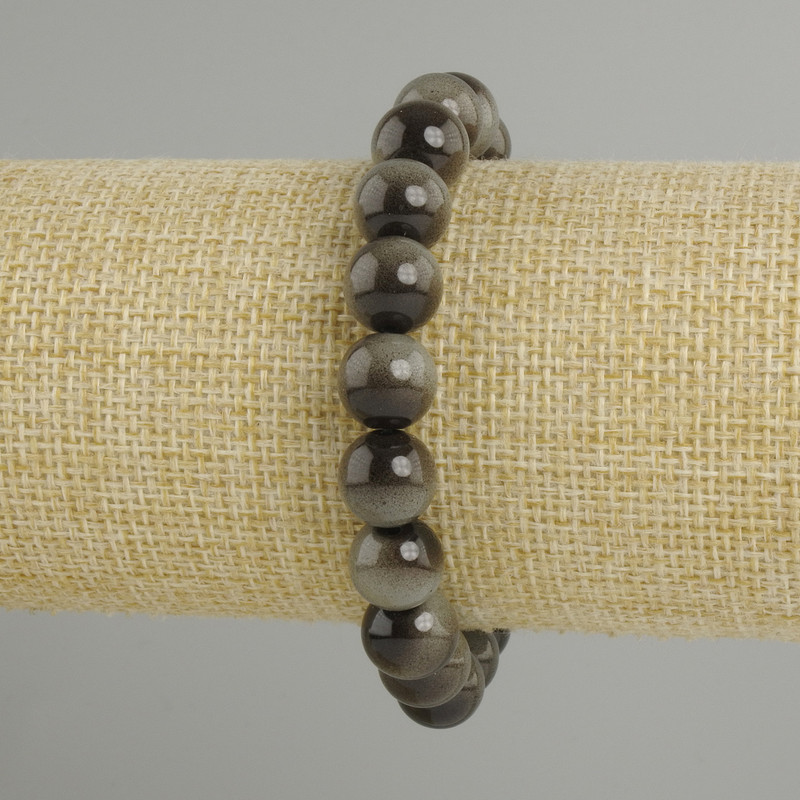 Bransoletka z szarego tygrysiego oka, gładkie kulki, średnica około 10 mm, długość około 18 cm, na elastycznej gumce