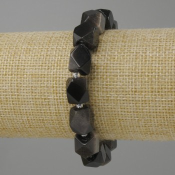 Bransoletka srebrzysty obsydian wielościany, średnica 12x10 mm +- koralik 3 mm+-, długość 18 cm +- na gumce