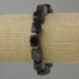Bransoletka srebrzysty obsydian wielościany, średnica 12x10 mm +- koralik 3 mm+-, długość 18 cm +- na gumce