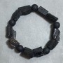 Bransoletka Turmalin Szerl, surowy kamień, średnica 14-16x11 mm ± kulka z szungitu 10 mm ±, długość 18 cm ±, elastyczna (stretch)