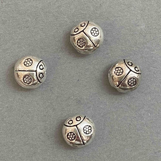 Koralik-wstawka w kształcie biedronki, kolor metalu 'srebro', śr. 10×10 mm, opakowanie 20 g ± 14 szt.