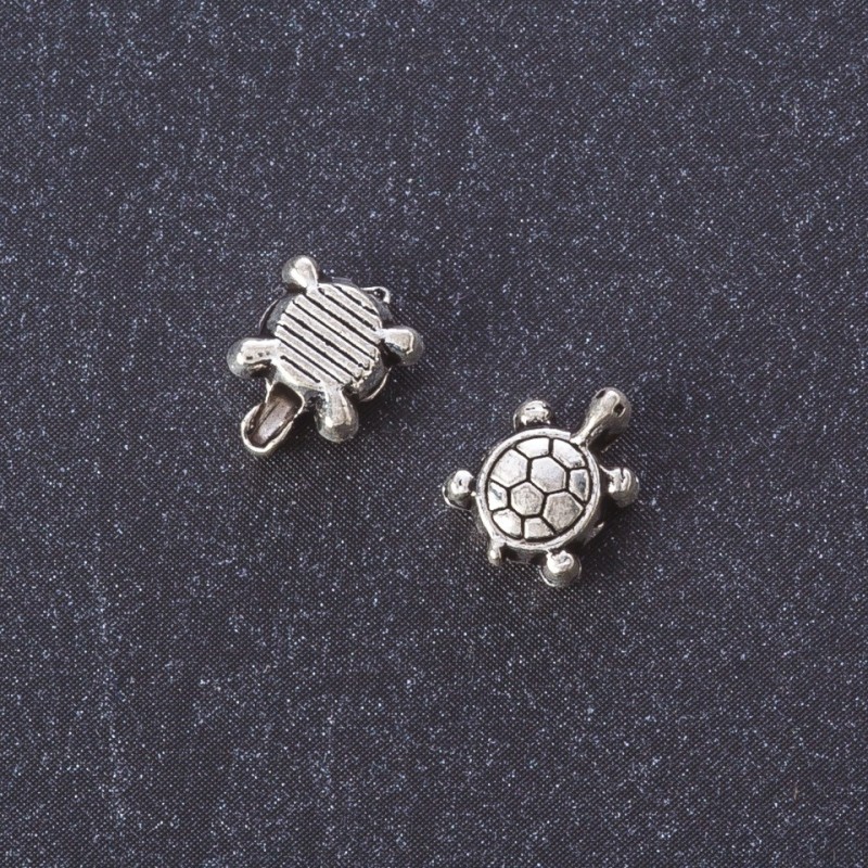 Furnitura jubilerska koralik-wstawka 'Muszelka' w kolorze metalu 'srebro' 7×8 mm opakowanie 20 g ± 40 sztuk