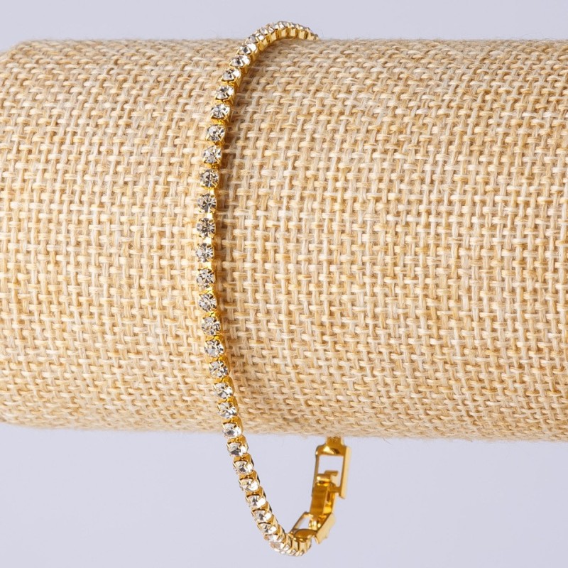 Bransoletka z kryształkami na zapięciu, jednorzędowa, kolor metalu „złoto”, długość 20 cm, szerokość 3 mm