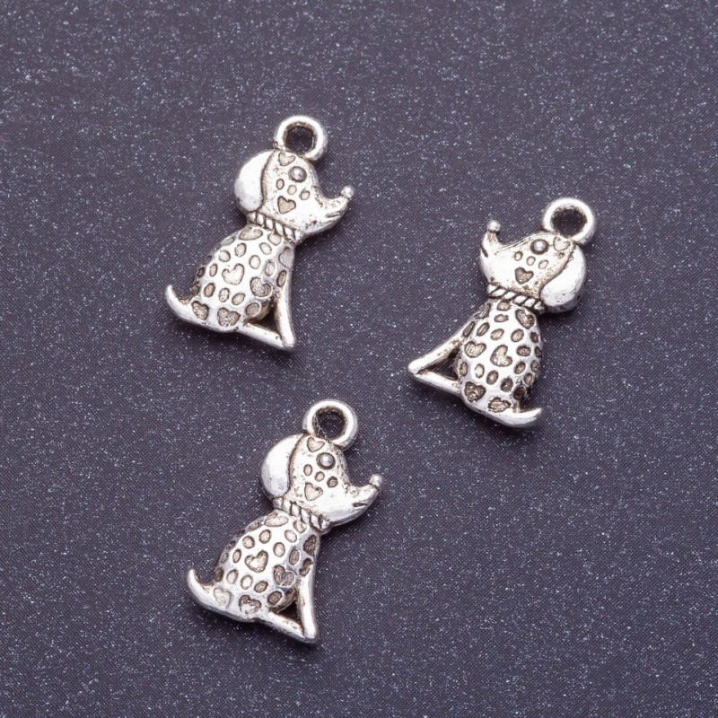 Zawieszka w kształcie psa, długość 18 mm, średnica otworu 1 mm, kolor srebrny, opakowanie 20 g +/- 19 szt.