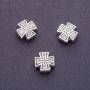 Koralik-wstawka w kształcie krzyża, długość 10 mm, średnica otworu 1,5 mm, kolor srebrny, opakowanie 20 g +/- 10 szt.