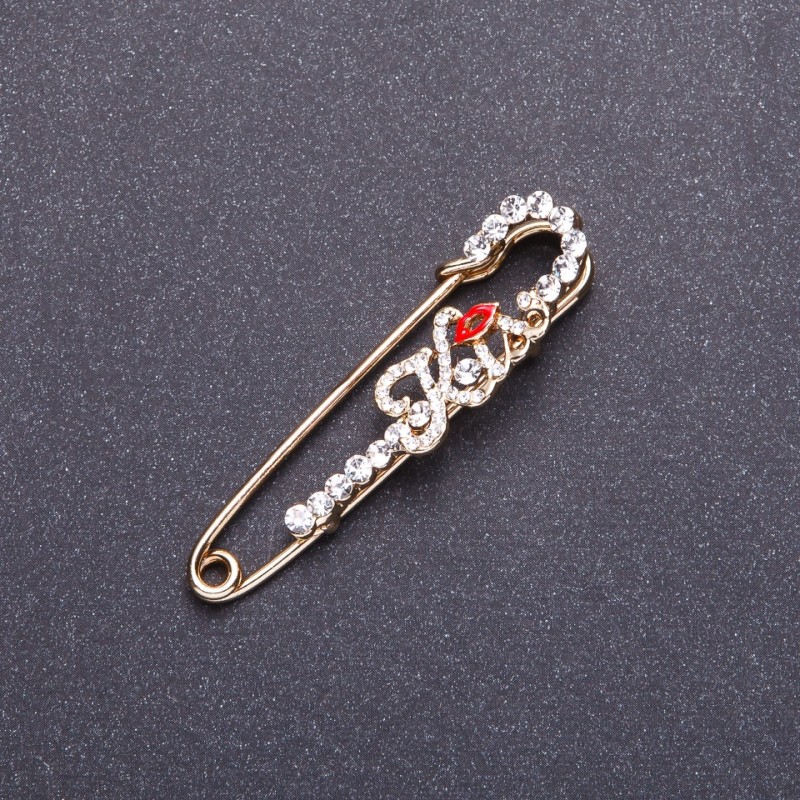Broszka-spinka „Kiss” metal złocisty 5,8×1,4 cm