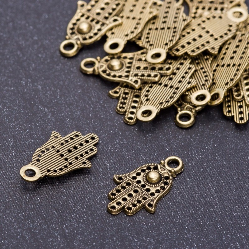 Zawieszka «Dłoń» w kolorze brązu, średnica 12 mm, długość 20 mm, otwór 3 mm, opakowanie 20 g, +/- 36 szt.