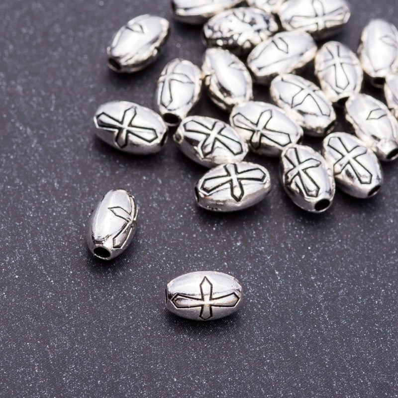 Koralik-wstawka w kształcie krzyża, wymiary 5×8 mm, otwór 5 mm, opakowanie 20 g ± 24 szt.