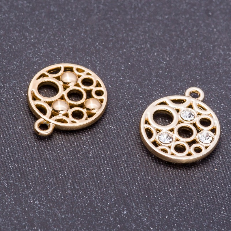 Zawieszka – medalion, średnica 14 mm, długość 17 mm, otwór; opakowanie: 7 szt.