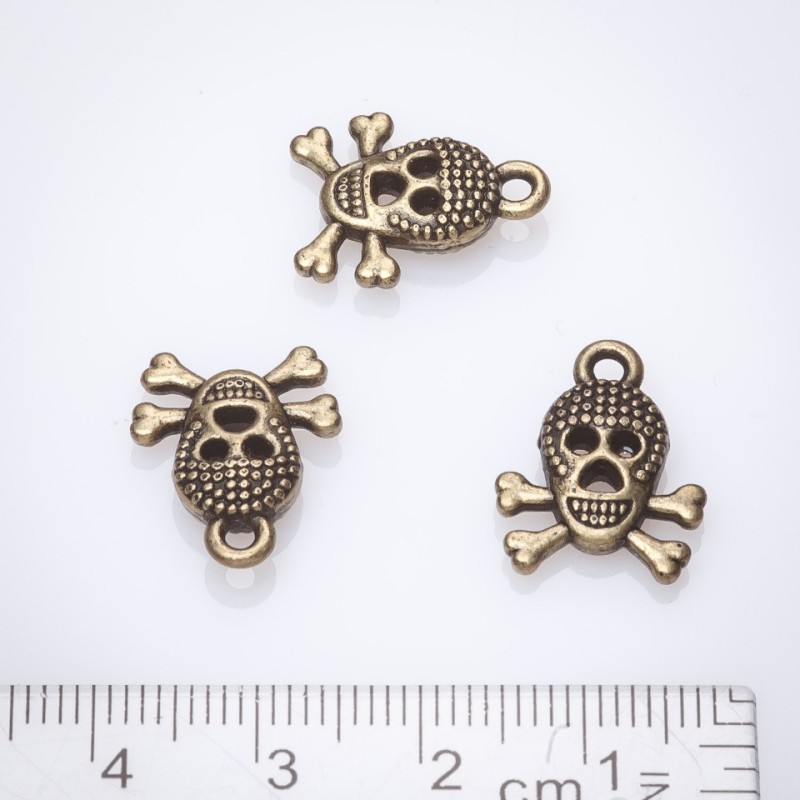 Zawieszka do biżuterii – czaszka 13×17 mm, kolor brązowy, wykończenie antyczny brąz, opakowanie 20 g, ±13 szt.