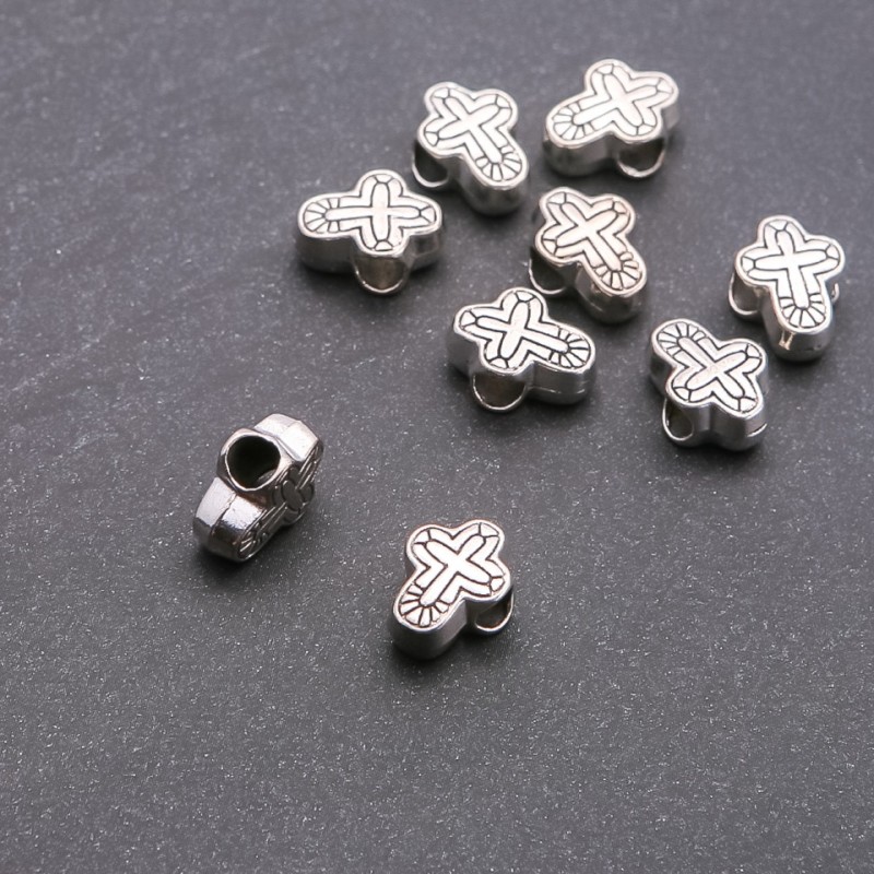 Koralik Pandora Krzyż, średnica 4,5 mm, długość 14×9 mm, fasetowany, 20 g ± 9 szt.