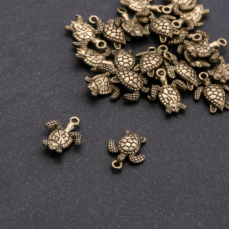 Zawieszka żółw brązowy, średnica 1,5 mm, długość 16×13 mm, opakowanie 20 g ± 22 szt.