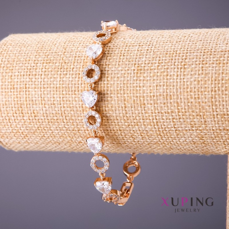 Bransoletka Xuping z białymi kamieniami strassowymi, długość 18–21 cm, grubość 8 mm, kolor złoty