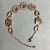 Bransoletka z złocistego metalu z białymi kryształami, średnica 12 mm, długość 16 mm + 3 cm przedłużający łańcuszek