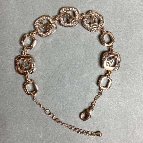 Bransoletka z złocistego metalu z białymi kryształami, średnica 12 mm, długość 16 mm + 3 cm przedłużający łańcuszek