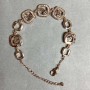 Bransoletka z złocistego metalu z białymi kryształami, średnica 12 mm, długość 16 mm + 3 cm przedłużający łańcuszek