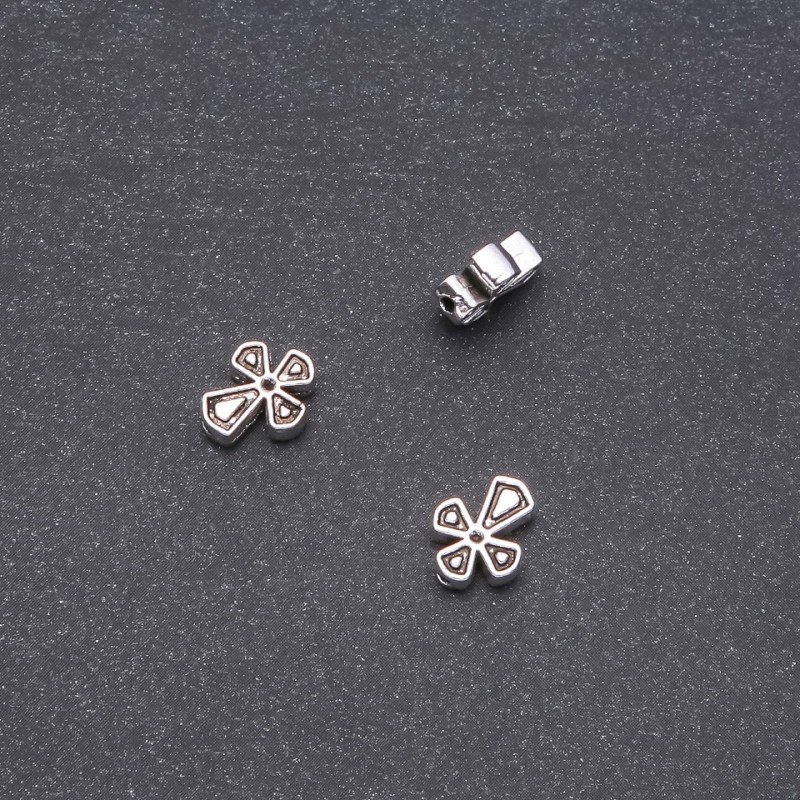 Koralik-wkładka w kształcie krzyża 9x11 mm fasetowana 20 g ±20 szt.