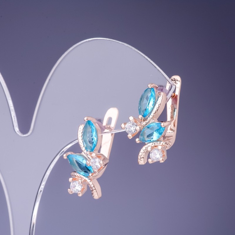 Kolczyki z błękitnymi kryształami 19×12 mm, w złotym metalu