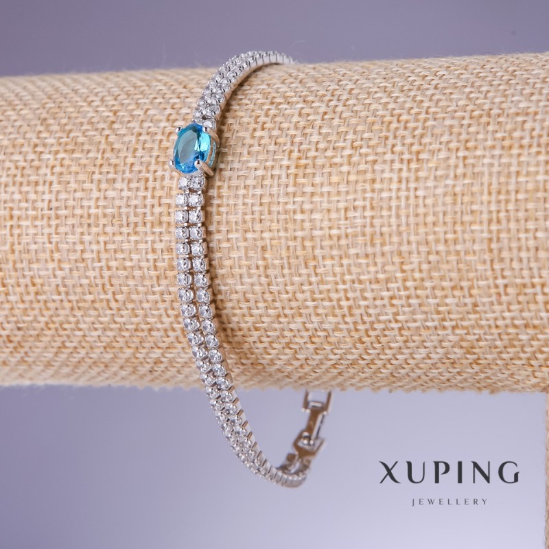 Bransoleta Xuping z błękitną cyrkonią «Topaz», grubość 6-4 mm, długość 17-19 cm, rodowanie 18K