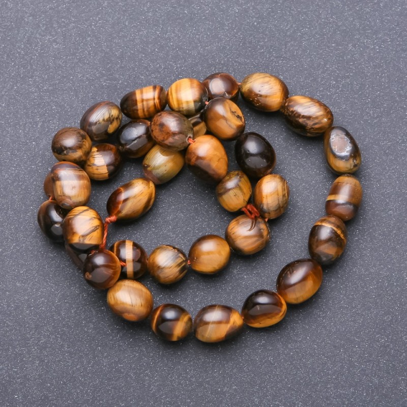 Koraliki z naturalnego kamienia tygrysiego oka fasetowane, średnica 9–12×8 mm, długość 38 cm