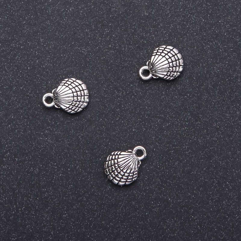 Zawieszka ozdobna Muszla, średnica 10 mm, długość 13 mm, średnica 1,5 mm, opakowanie 20 g, 18 szt. (+ -)