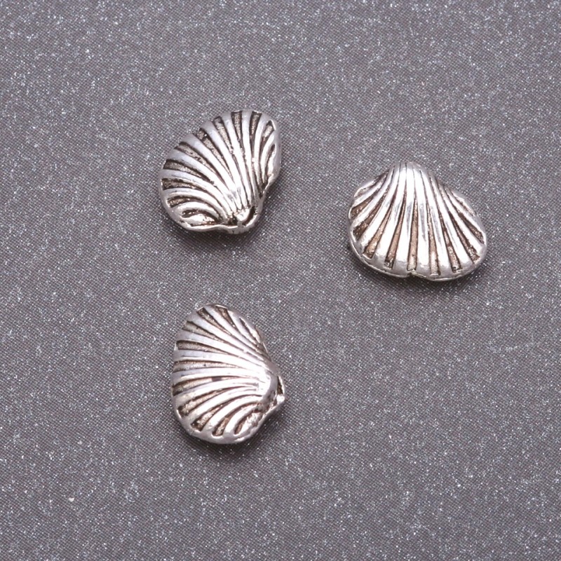 Koralik-wstawka, średnica 10x9 mm, średnica wewnętrzna ok. 1,5 mm, opakowanie 20 g, +/-16 szt