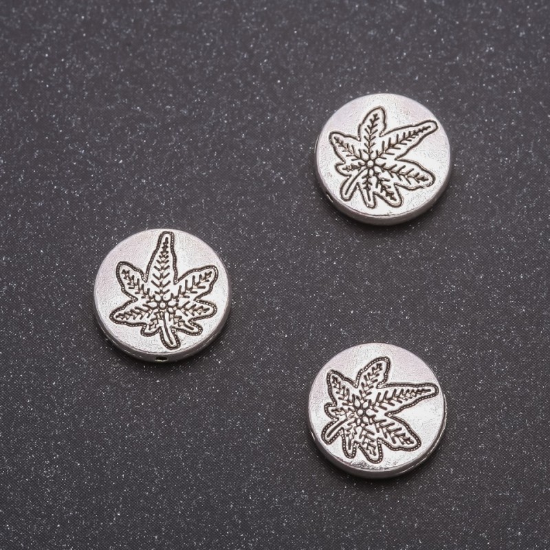 Koralik-wkładka Liść konopi, średnica 12×3,5 mm, otwór 1 mm, opakowanie 20 g ± 11 szt.