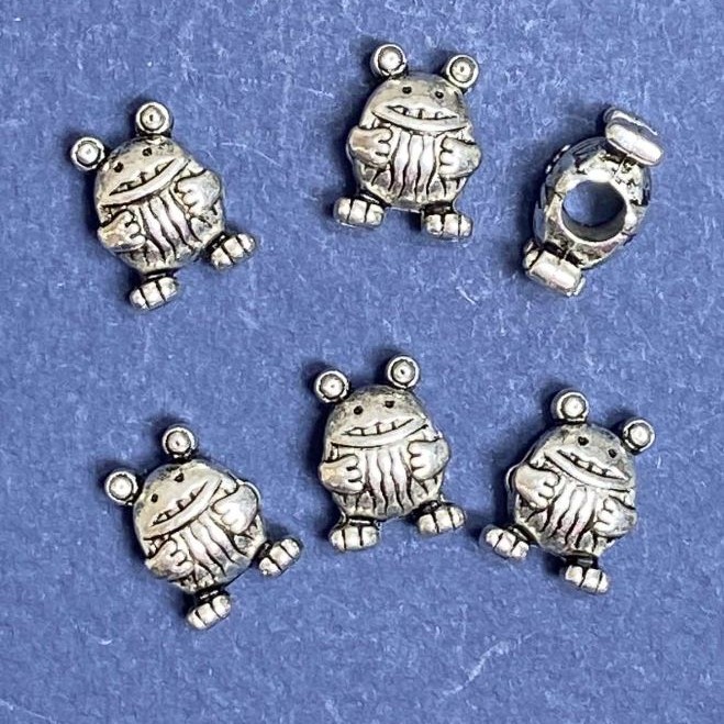Koralik Żaba 10×14 mm, średnica otworu 5 mm, opakowanie 20 g, ±8 szt.