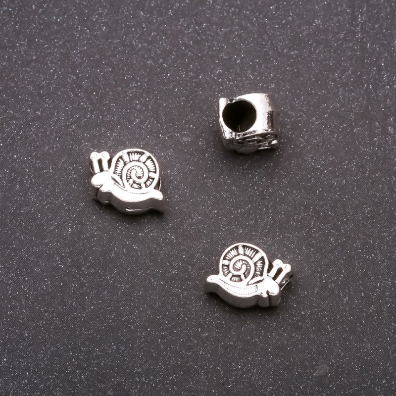 Koralik-wkładka Pandora Spiral, średnica 11x9 mm, średnica wewnętrzna 4 mm, opakowanie 20 g +/- 11 szt.