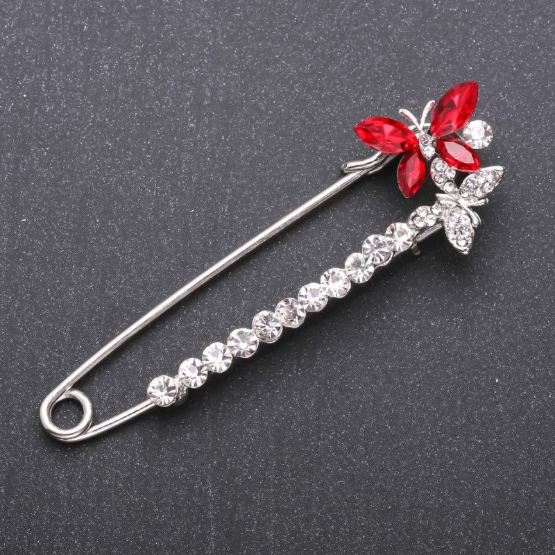 Broszka-spinka z czerwonymi kryształami ze szkła 78×24 mm, metal biały