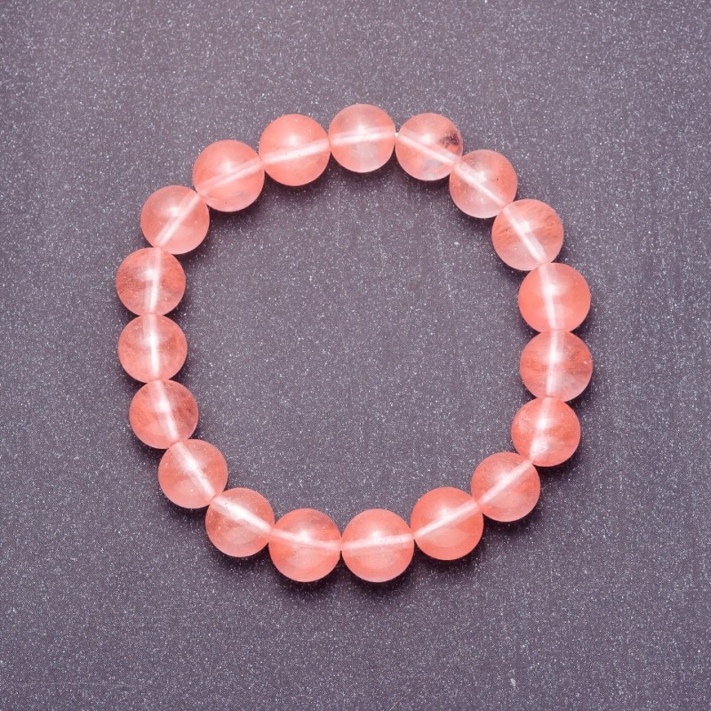 Bransoletka z naturalnego kamienia chalcedonu — gładkie kuleczki o średnicy 8 mm (+/-) na elastycznej gumce, obwód 18 cm