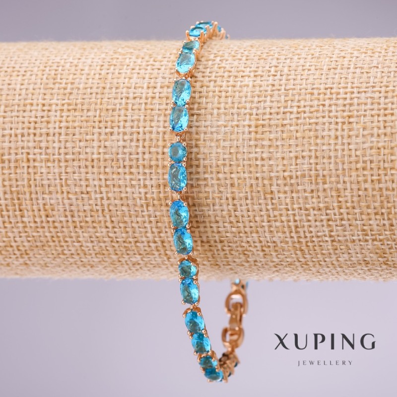 Bransoletka Xuping z błękitnymi kamieniami, grubość 4 mm, długość 18–20 cm, pozłacana z łańcuszkiem przedłużającym