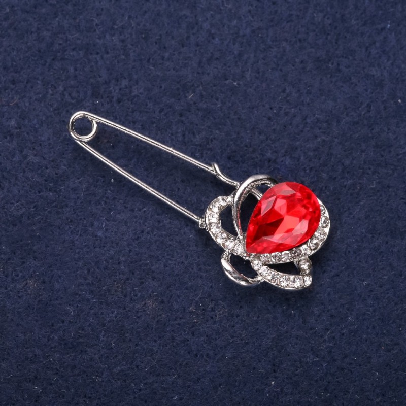 Broszka-spinka Kwiat z białymi cyrkoniami i czerwonym kamieniem, 46×19 mm, metal srebrzysty