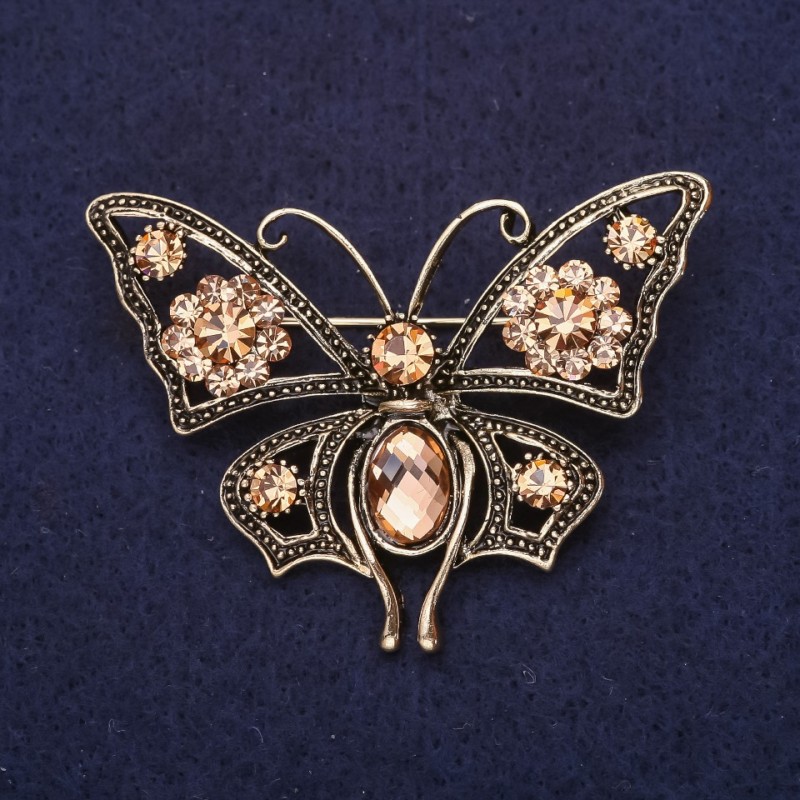 Broszka Motyl z kryształami w kolorze szampańskim, 54×40 mm, z żółtego metalu