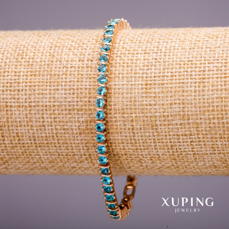 Bransoletka Xuping z kamieniami w kolorze błękitnym, grubość 4 mm, długość 18–19 cm, pozłacana