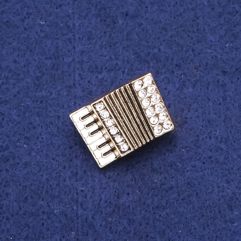 Broszka w kształcie akordeonu z kryształami, metal złocisty 24×17 mm