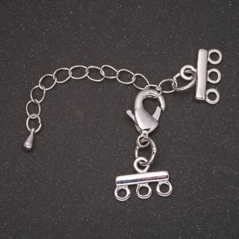 Zamek do bransoletek i koralików na 3 nici z przedłużającym łańcuszkiem, metal w kolorze srebrnym, średnica 10×14 mm, długość 5 cm