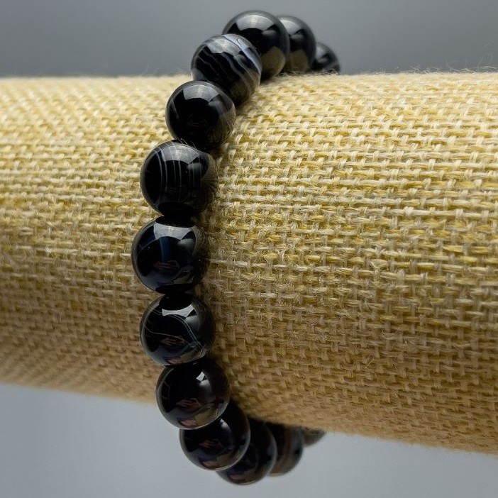 Bransoletka z naturalnego agatu, gładkie kulki, średnica około 10 mm, na elastycznej gumce, obwód 18 cm