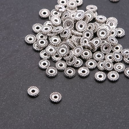Furnitury jubilerskie: rozdzielnik koralików, średnica 6 mm, otwór 1,5 mm, opakowanie 20 g ± 110 szt.