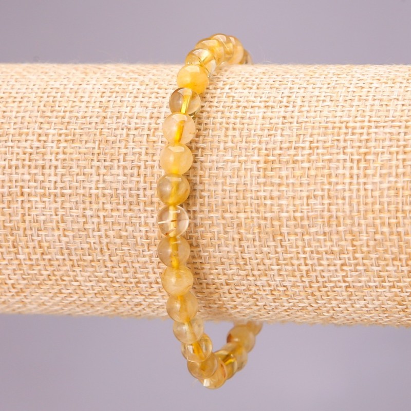 Bransoletka z naturalnego kwarcu włosowatego na elastycznej gumce, gładkie kulki, średnica ok. 6 mm, długość 18 cm