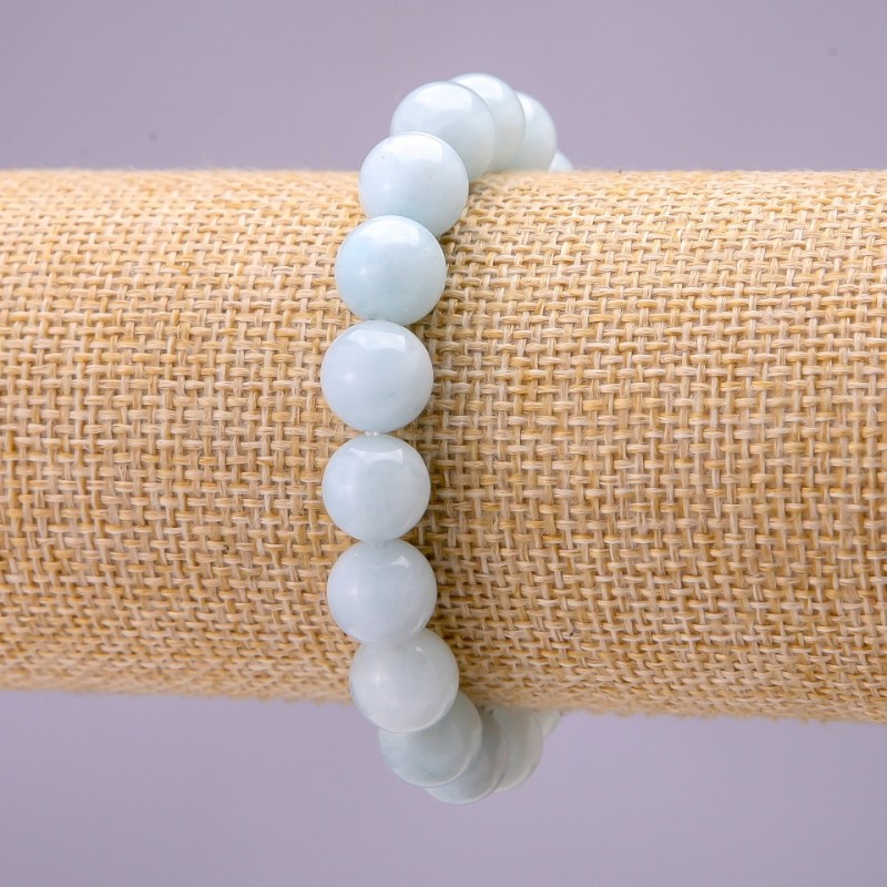 Bransoletka z naturalnego kamienia akwamarynu – gładkie kuleczki o średnicy około 10 mm, na gumce, długość 18 cm
