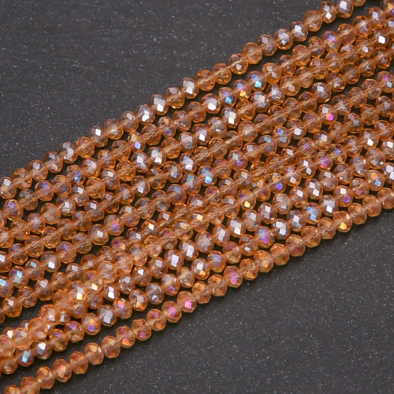 Koraliki czeskiego kryształu bursztynowe w kształcie rondelle, przezroczyste z powłoką benzynową, średnica 3,5×3 mm, nawlekane na nitkę, długość 38 cm
