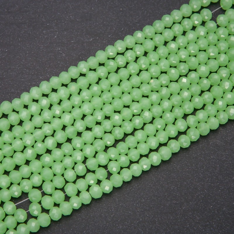 Koraliki z czeskiego kryształu półmatowe limonkowe 'rondele', średnica 6×4,5 mm, długość nici 38 cm