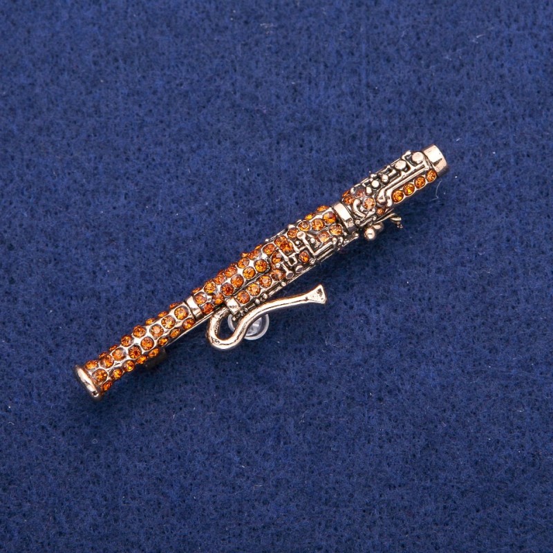 Broszka w kształcie fagotu z żółtymi cyrkoniami 12×62 mm, metal złocisty