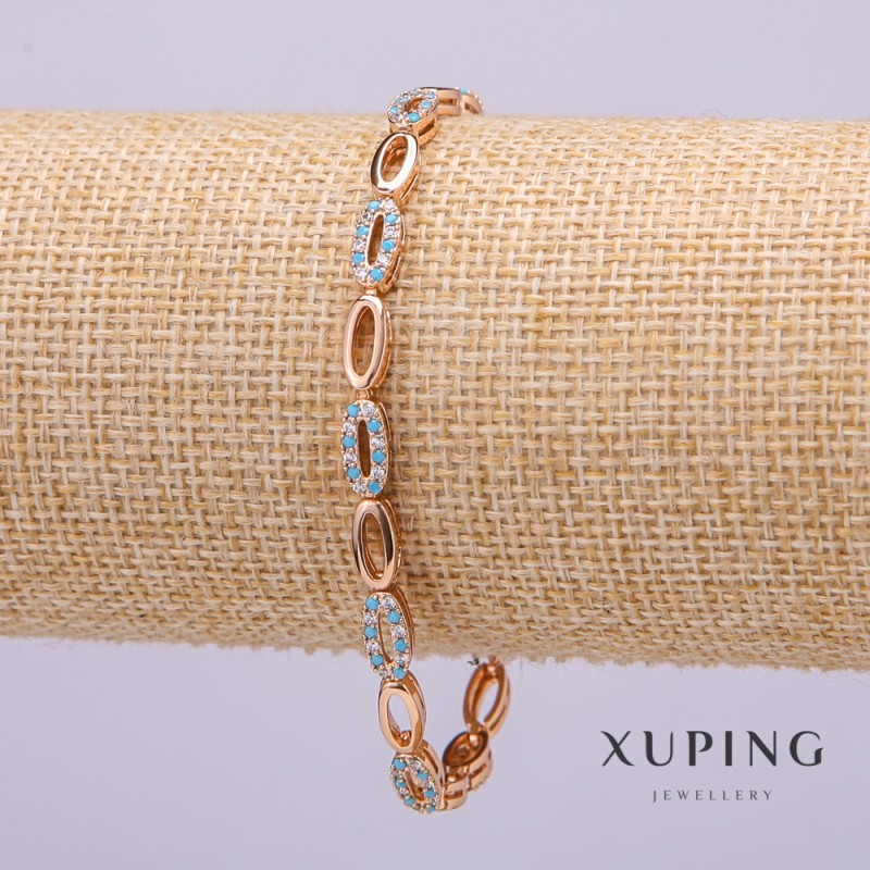 Bransoletka Xuping z białymi i błękitnymi kamieniami, grubość 4 mm, długość 19 cm, pozłacana