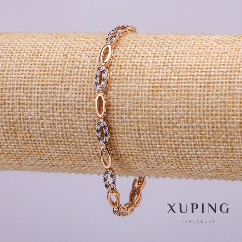 Bransoletka Xuping z białymi i niebieskimi kamieniami, grubość 4 mm, długość 19 cm, pozłacana