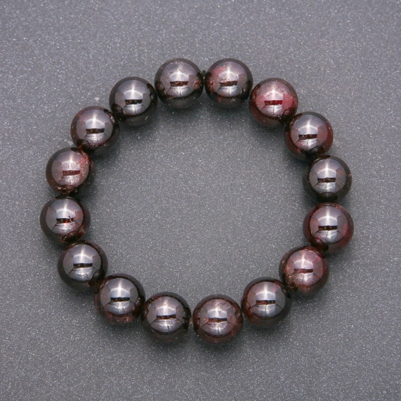 Bransoletka z naturalnego granatu na gumce, gładka kuleczka, średnica ok. 12 mm, długość 18 cm