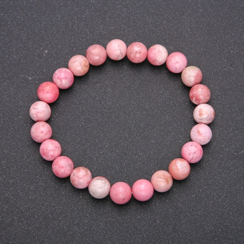 Bransoletka z naturalnego rodokrozytu na elastycznej gumce, gładka kulka o średnicy około 10 mm, długość 18 cm