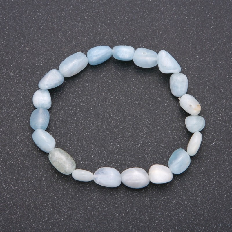 Bransoletka z naturalnego kamienia akwamarynu na elastycznej gumce, średnica 7×10 mm (±), obwód 18 cm