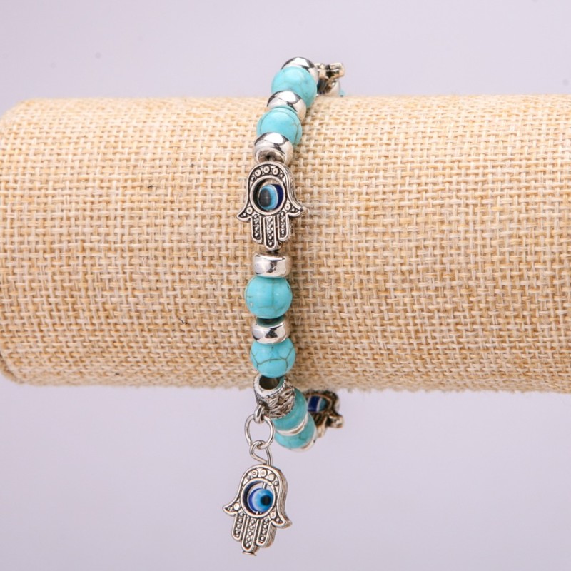 Bransoletka-amulet z turkusem z niebieskimi „oczami” na gumce, średnica 12 mm (±), długość 18 cm, z wstawkami i zawieszką